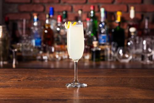 a glass of white drink sitting on a bar at St. Petersburg Marriott Clearwater in St. Petersburg