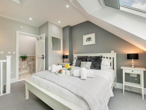 a bedroom with a large white bed in a room at 3 Bed in Beadnell oc-cn113 in Beadnell