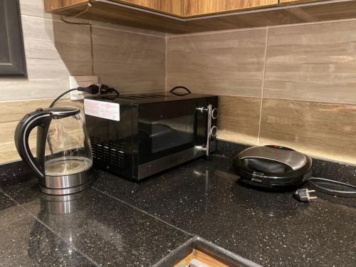 Příslušenství pro přípravu čaje a kávy v ubytování loved modern home