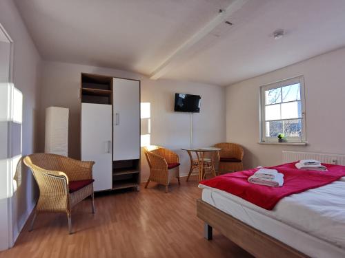 En eller flere senge i et værelse på Domizil Am Stadtzentrum