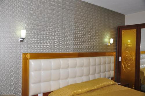 Katil atau katil-katil dalam bilik di Kayalar Hotel