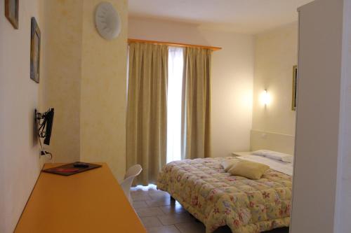 Ένα ή περισσότερα κρεβάτια σε δωμάτιο στο Hotel del Sole