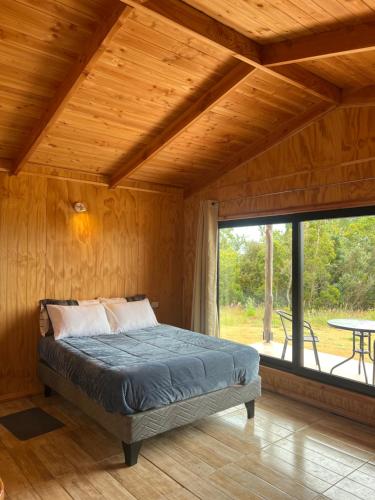 Giường trong phòng chung tại Cabañas BERGHAUS