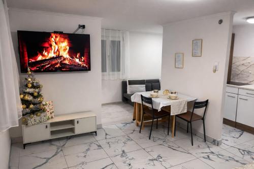 TV a/nebo společenská místnost v ubytování Rigókert Vendégház