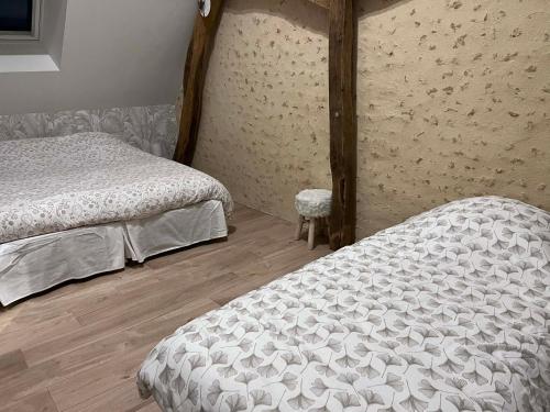 Llit o llits en una habitació de La p'tite maison