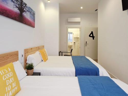 Postel nebo postele na pokoji v ubytování Bilbao ROOMS & KITCHEN Altube