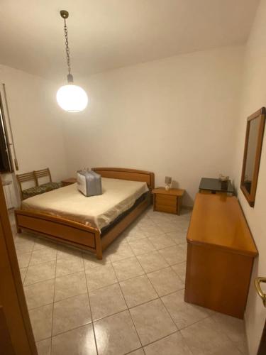 Ένα ή περισσότερα κρεβάτια σε δωμάτιο στο Tamagno Residence - Comfort in the Heart of the City