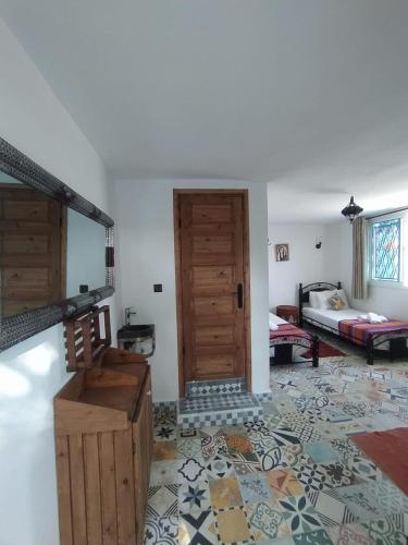 Ένα ή περισσότερα κρεβάτια σε δωμάτιο στο Rif House MEDIOUNA