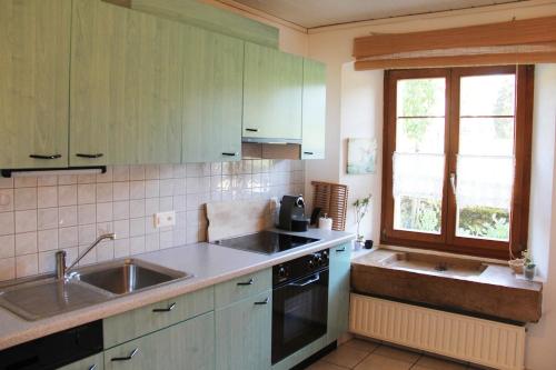 Kuchyň nebo kuchyňský kout v ubytování Appartement au coeur de la nature