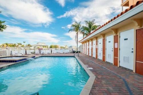 a swimming pool in the courtyard of a building at Luxury 5 Star Waterfront Condo 3 Bdr 2 Bath Pool Hot-Tub Panoramic Gulf and Intracoastal Waterway Views in Clearwater Beach