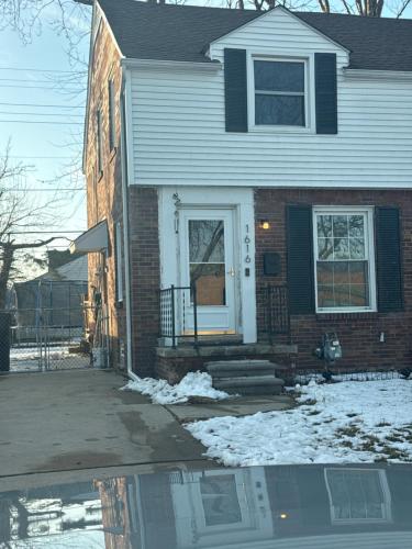 a house with a puddle of water in front of it at Home Away from Home in Wyandotte