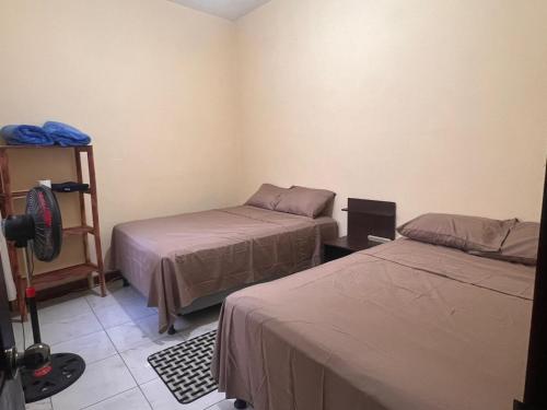 Giường trong phòng chung tại Casa Vásquez