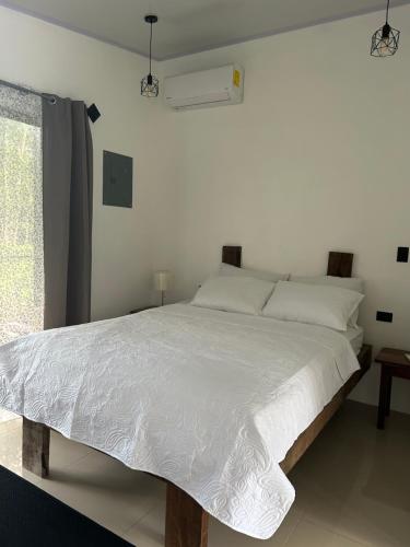 En eller flere senge i et værelse på Bungalows Chachagüita