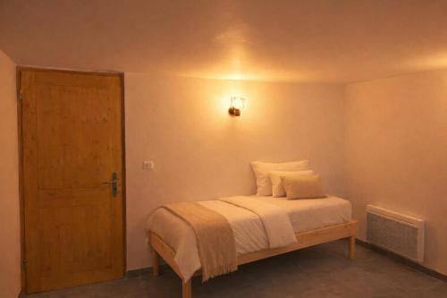 Ένα ή περισσότερα κρεβάτια σε δωμάτιο στο Le JoliCoeur