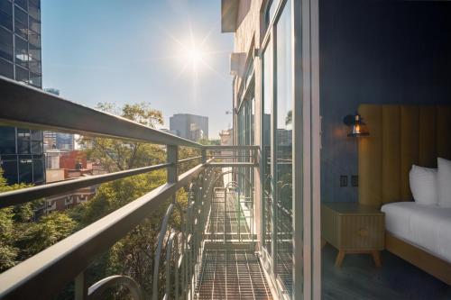 a balcony with a view of a city at Pandora House in Mexico City