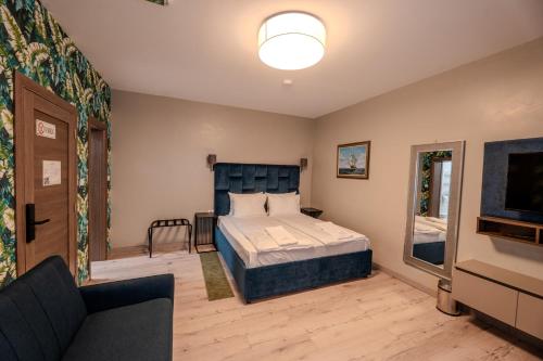 Giường trong phòng chung tại Garni Hotel Mediteraneo