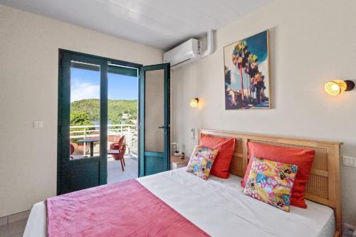 En eller flere senge i et værelse på Villa Arlet