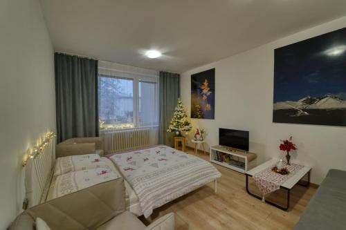 Postel nebo postele na pokoji v ubytování Apartmán Tatranská Lomnica
