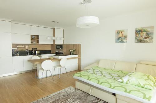 a bedroom with a bed and a table and chairs at Vienna Apartments Hauptbahnhof in Vienna