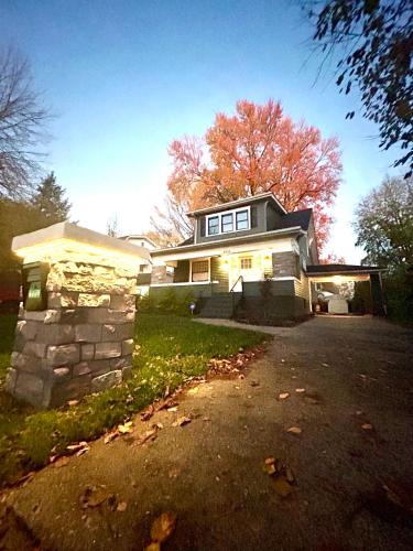 a large house with a stone wall at Derby and Downtown in Louisville