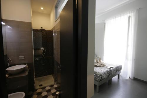 a bathroom with a sink and a toilet and a shower at B&B Sinfonia Sul Tevere in Rome