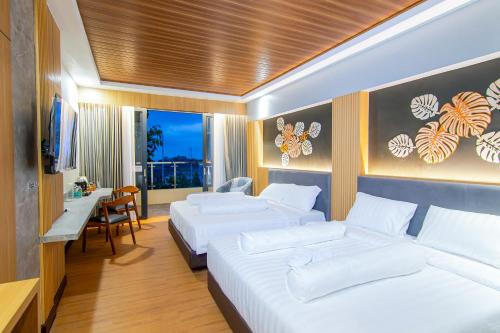 Postel nebo postele na pokoji v ubytování Azana BeSt Hotel