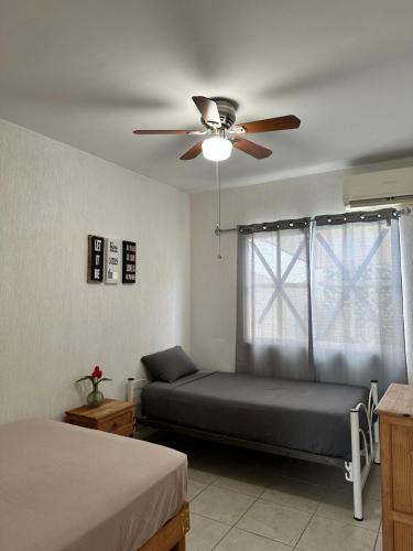 En eller flere senge i et værelse på Hermosa casa céntrica en Playa del Carmen