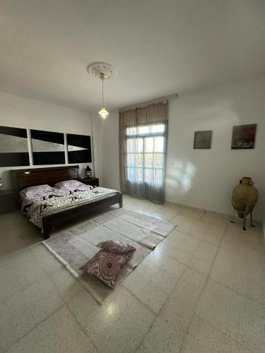 En eller flere senge i et værelse på Appart 2