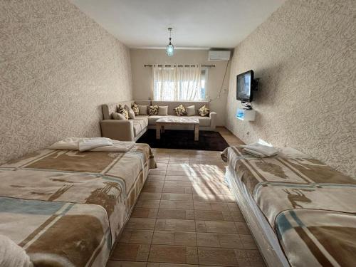 Ένα ή περισσότερα κρεβάτια σε δωμάτιο στο Malika studio