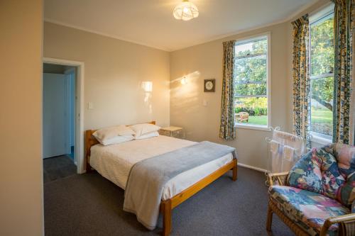 Postel nebo postele na pokoji v ubytování Lancewood Lodge