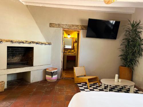 TV a/nebo společenská místnost v ubytování Ombligo