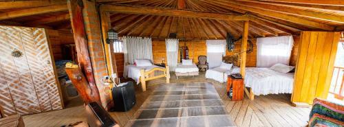 a room with a bedroom with a bed and a couch at Cabaña Privada Pachamama Ancestral in Medellín