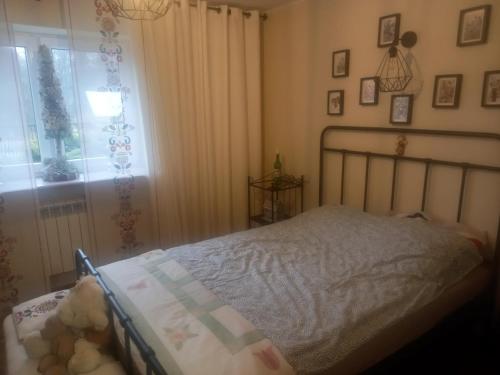a bedroom with a bed and a window at Owocowa Chojnata in Chojnata