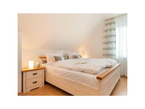 Ένα ή περισσότερα κρεβάτια σε δωμάτιο στο Holiday home in Zingst with swimming pool