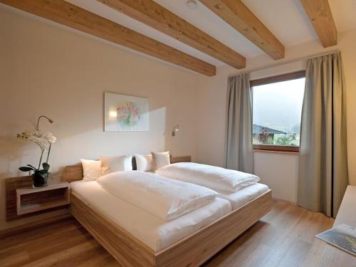 En eller flere senge i et værelse på Resort Tyrol Brixen