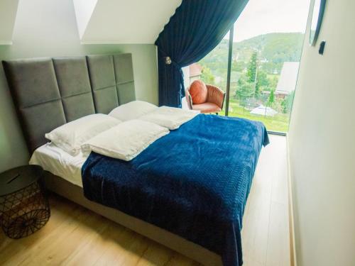 Giường trong phòng chung tại A comfortable house in Kashubia for 6 people