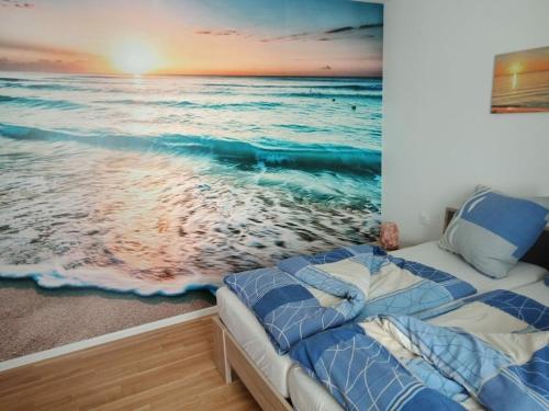 En eller flere senge i et værelse på Riverfront Kappeln