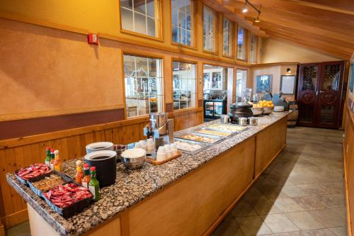 a kitchen with a counter with food on it at Icicle Village Resort in Leavenworth
