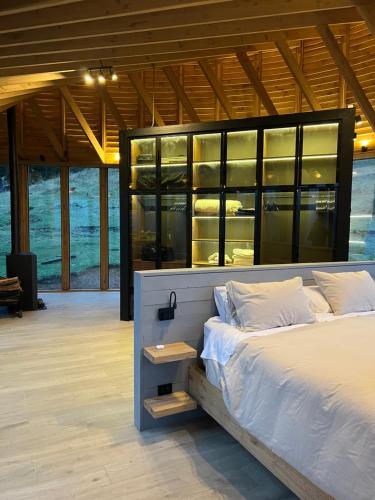 a bedroom with a large bed in a building at Punto Cero Patagonia in Bahía Murta