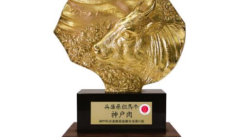 a trophy for a horse on a wooden stand at KAMENOI HOTEL Arima in Kobe
