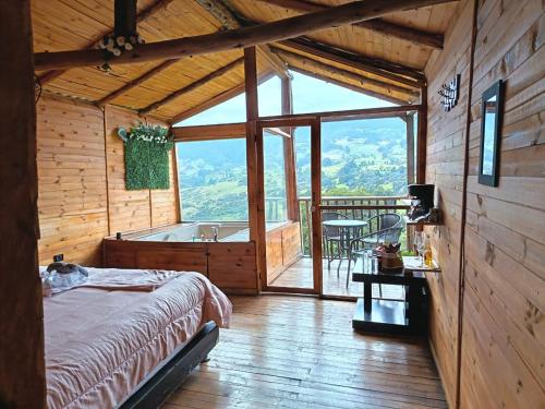 En eller flere senge i et værelse på Glamping Mirador al Cielo