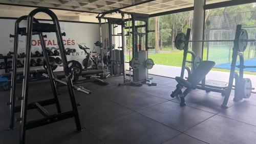 a gym with several tread machines in a room at Escapada Premium en San Bernardino! Toledo House in San Bernardino