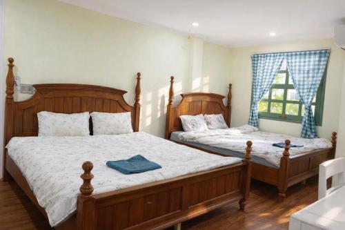 Postel nebo postele na pokoji v ubytování HCA Homestay