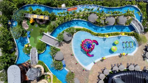an overhead view of a pool at a theme park at Grande Centre Point Space Pattaya in North Pattaya