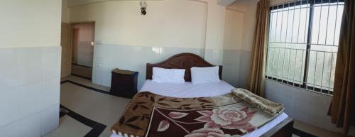 Postel nebo postele na pokoji v ubytování Bilal Guest House Murree