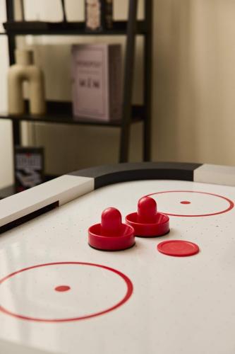 a group of red hearts on top of a table at Grand 4BR Paddington Terrace - Free parking in Sydney