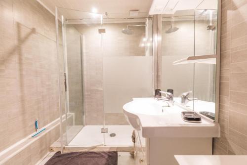 a bathroom with a sink and a shower at Bachale in Lamothe