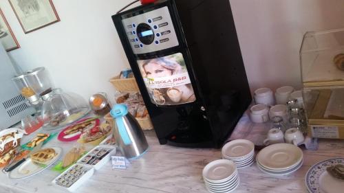 a refrigerator with a picture of a child on it at B&B L'Isola in Porto Cesareo