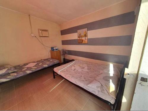 Postel nebo postele na pokoji v ubytování Kantil Dive Resort