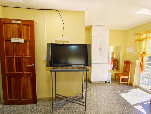 a television sitting on a table in a room at Baguio Staycation with Mountain View in La Trinidad